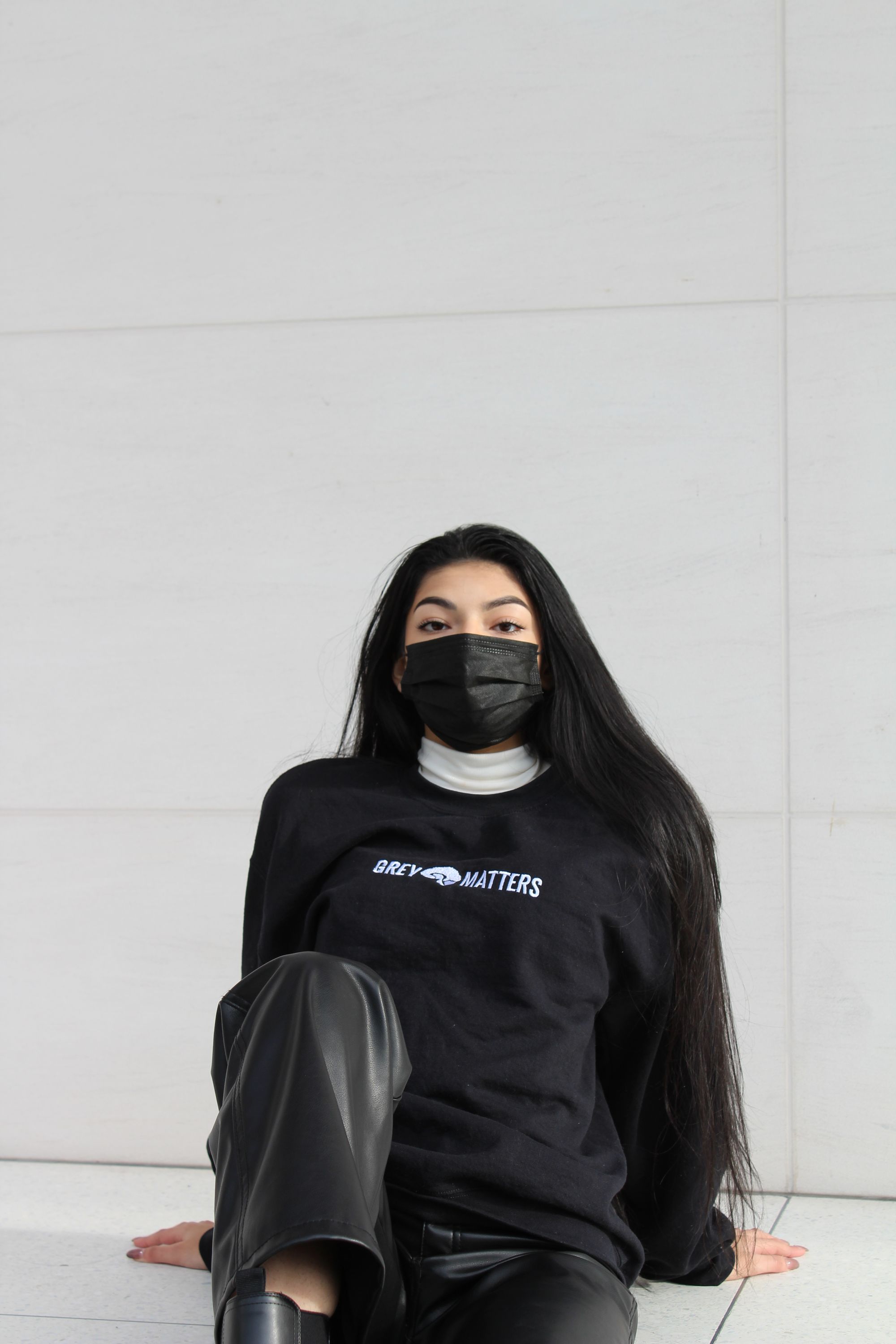 front view of a model wearing a Grey Matters sweatshirt