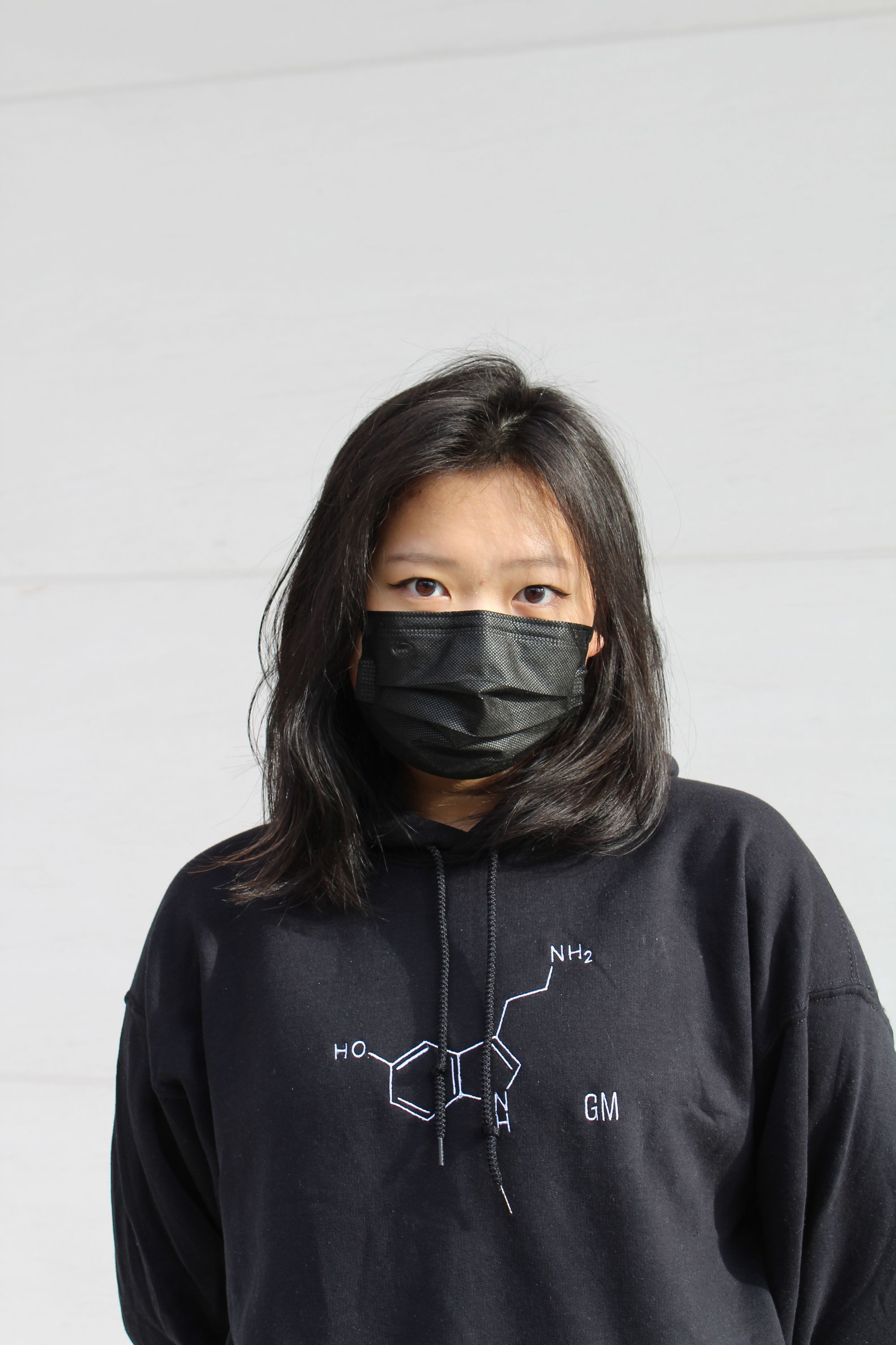 close-up of a model wearing the serotonin hoodie